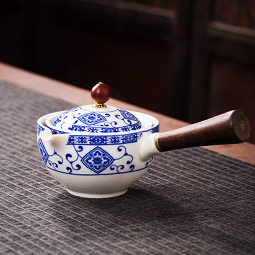 360 degree rotating tea maker in blue and white porcelain with wooden side handle
